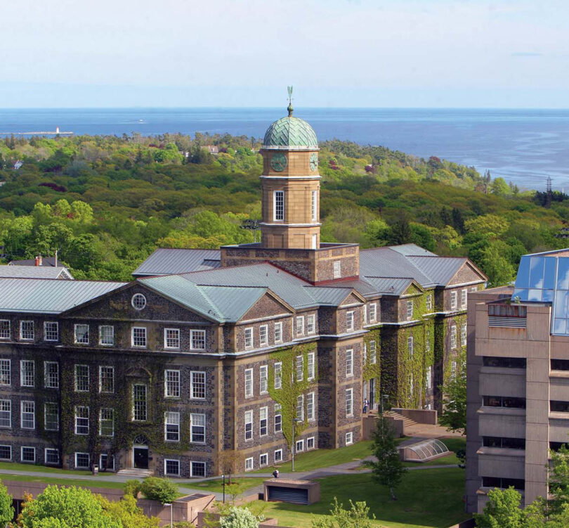 large bright university buildings overlooking the ocean