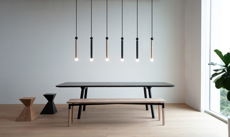 dining table and bench with six hanging pendant lights