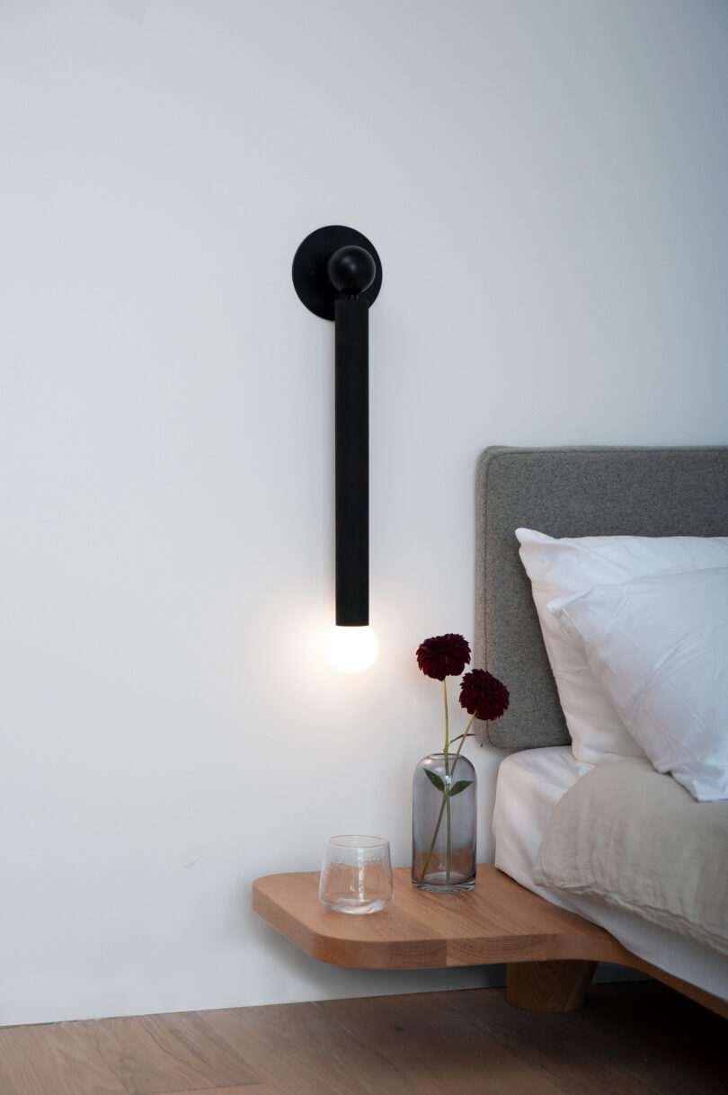 wall-mounted black bedside lamp