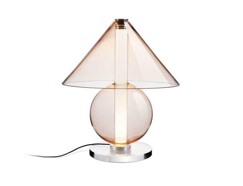 all glass light amber hued lamp with round base and cone-shaped shade on a white background