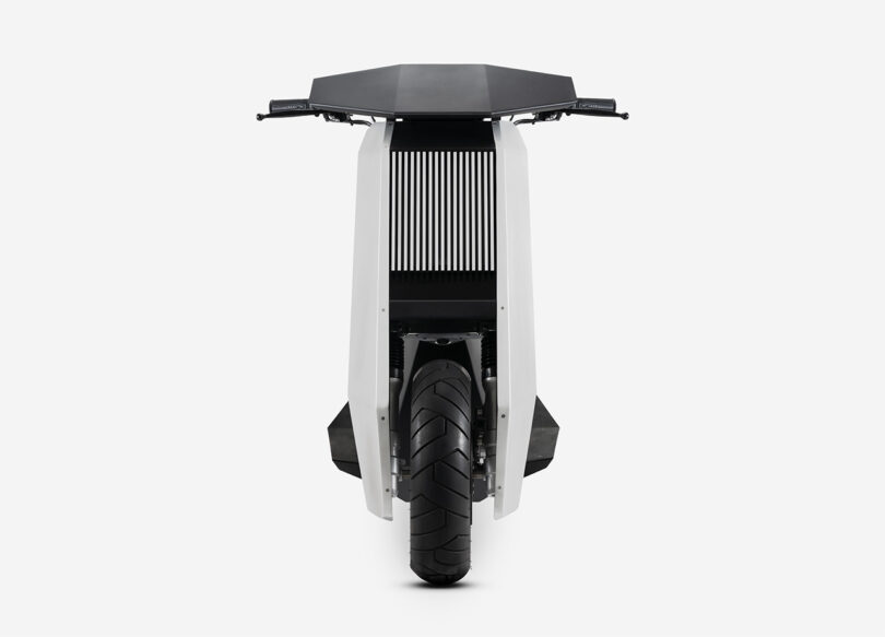 Straight on front view of the Infinite Machine P1, a 2-wheeled electric scooter shaped with a sharp minimalist aesthetic of metal panels, grills, and black coordinated surfaces.