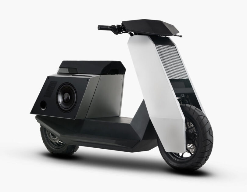 P1 electric scooter shown with dual attachable, battery-powered speaker system on each flank below the seating area.