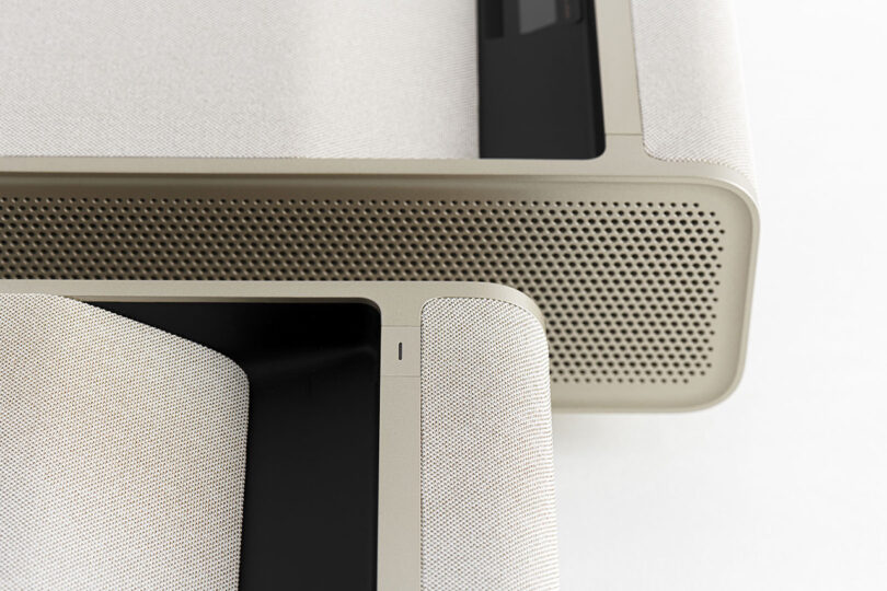 Close up detail of XGIMI Mira UST projector's side perforated speakers.