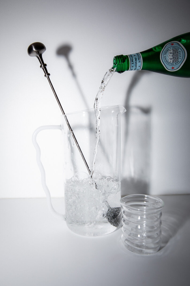 glass cocktail set with clear pitcher, clear measuring glass, and stirrer