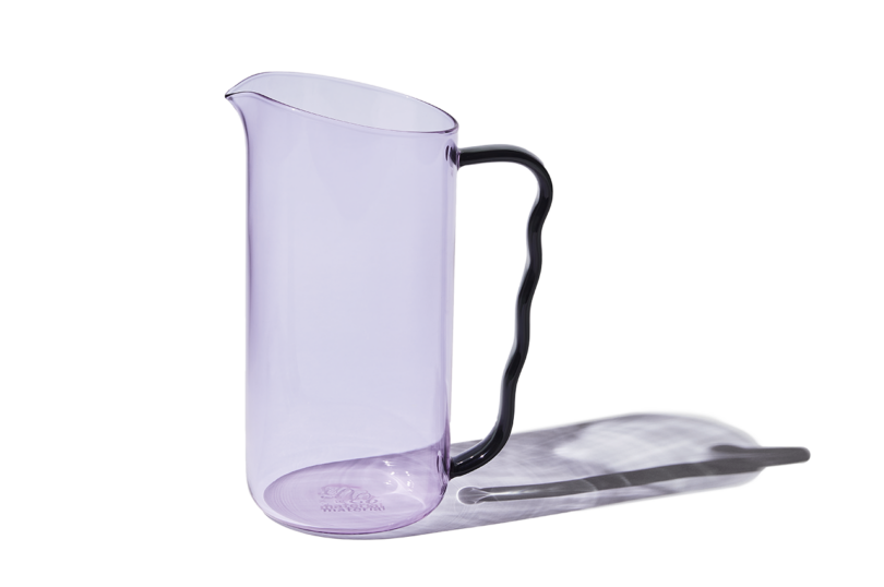lilac glass cocktail pitcher on white background