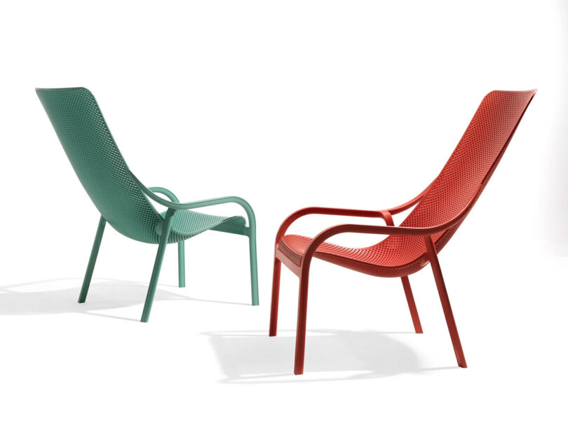 red and green hard plastic lounge chairs on white background