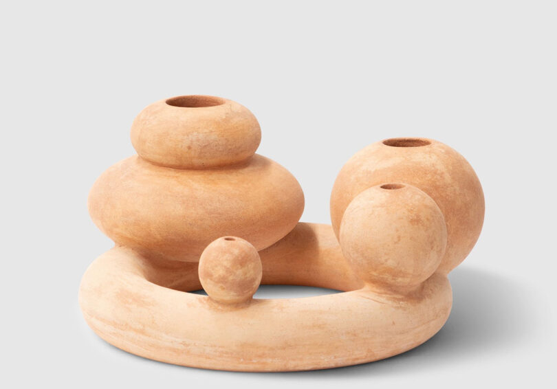 A curvaceous terracotta form inspired by the at-times weird and wonderful shape of flowers.