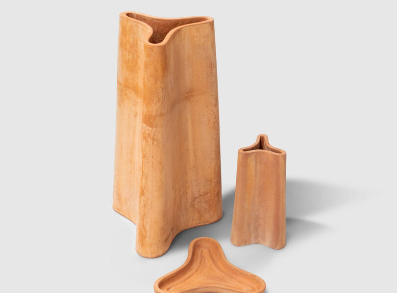 A free-flowing umbrella holder, inspiredby the ribbed oil and water jars of Greece. The three-part, compartment-like form is tapered for stability and form-ribbed for strength. Included in the range is a smaller vase version, along with a fruit platter with a ribbed base, designed to allow fruit to breathe.