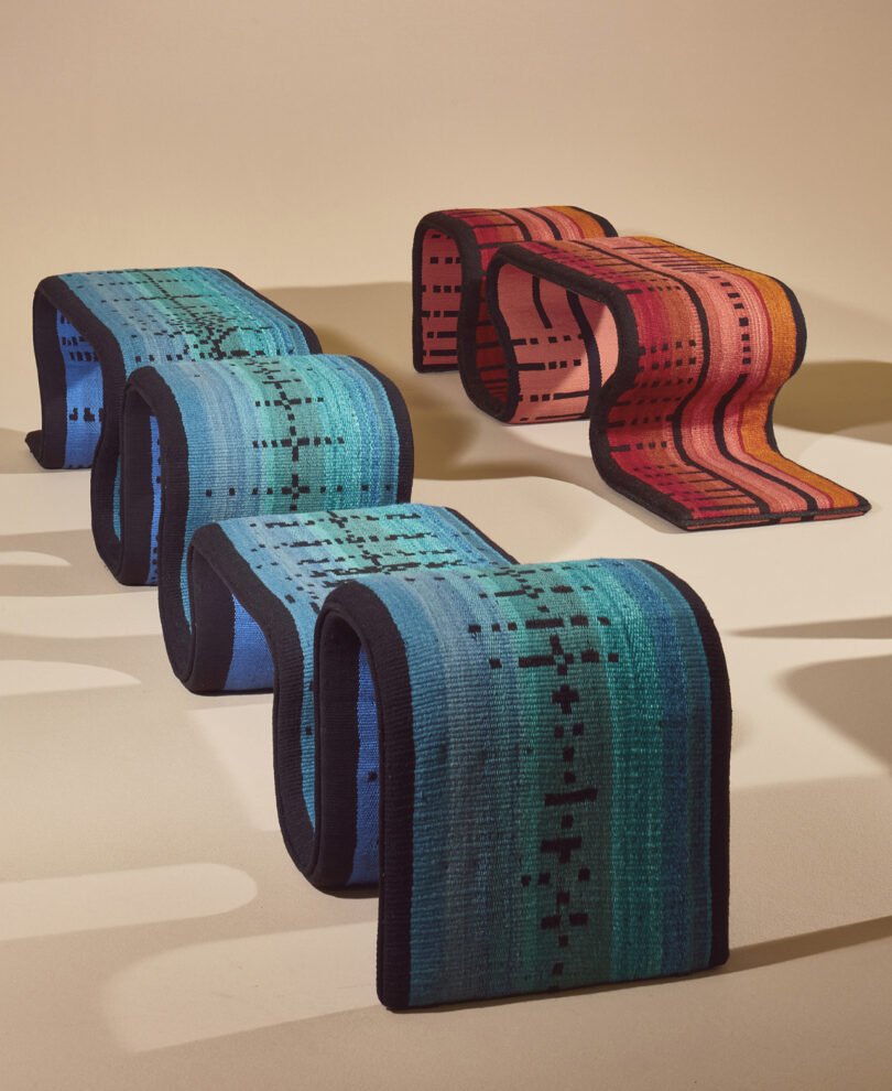 two red and blue woven benches with an undulating shapes