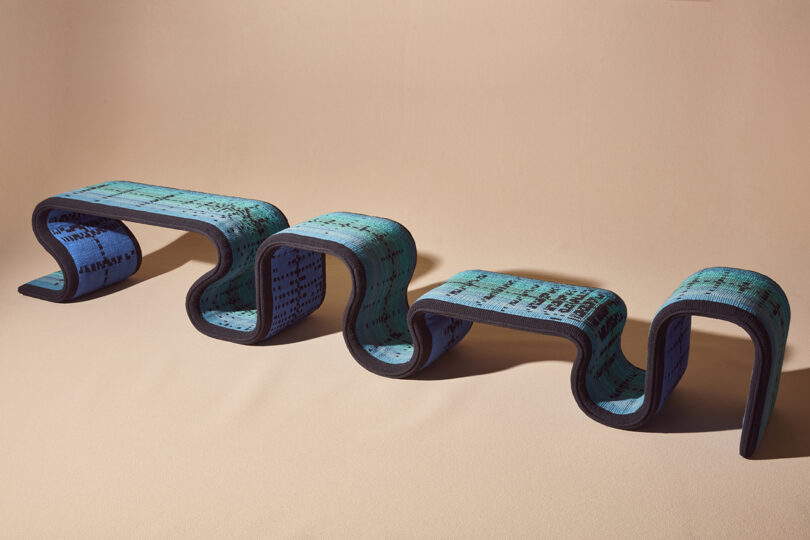 blue woven bench with an undulating shape