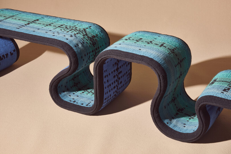 blue woven bench with an undulating shape