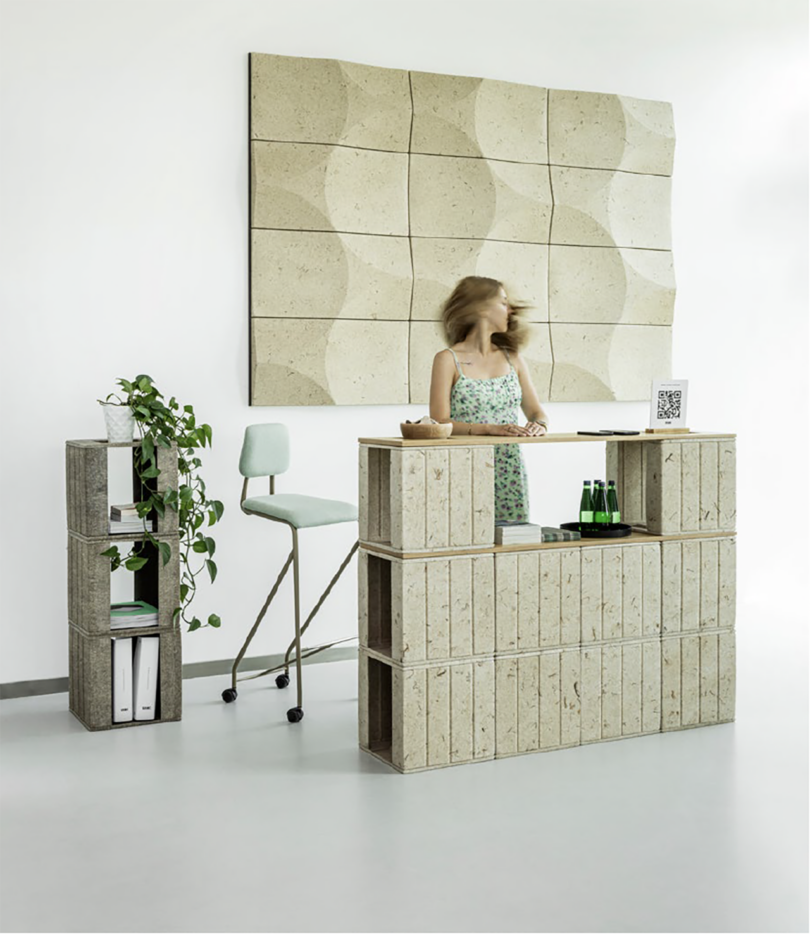 receptionist area with a desk and counter made out of modular sustainable cubes