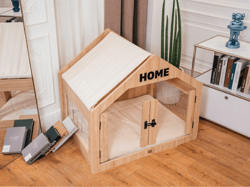 angled down view of modern wood and plexi indoor dog house