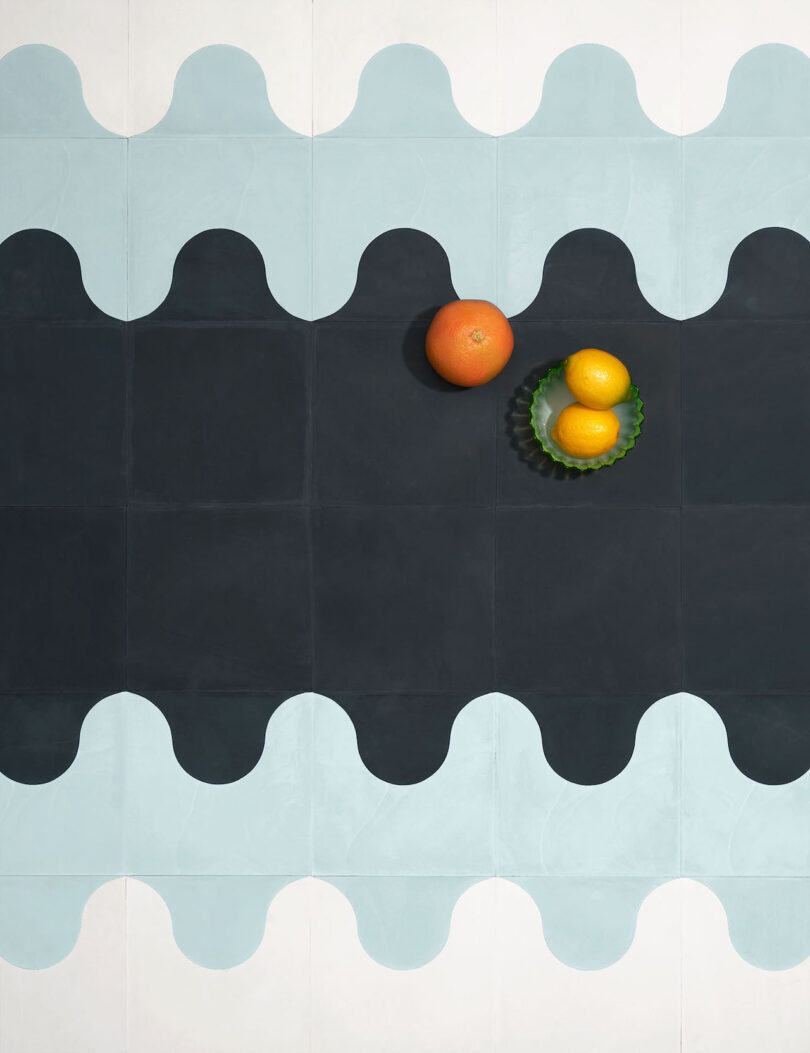 fruit on top of white black and teal tiles