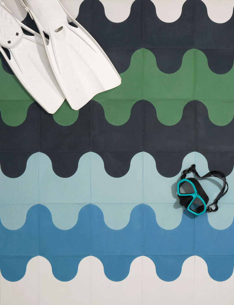snorkel fins on blue black and green tiles