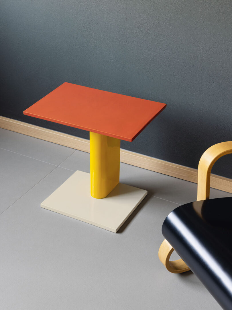 color block table next to black chair