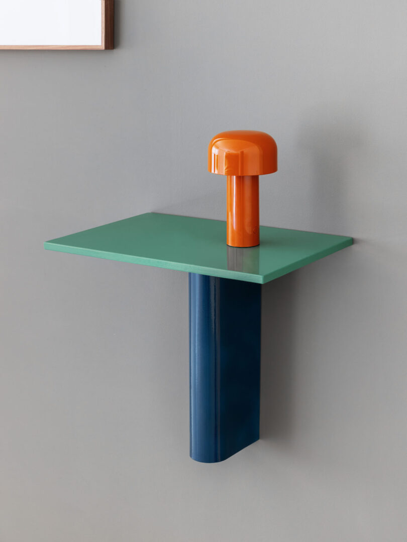red table light on wall-mounted green and blue table