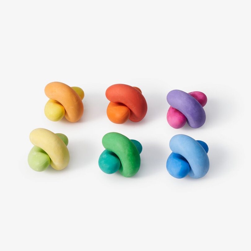 six colorful chalk shaped like beans