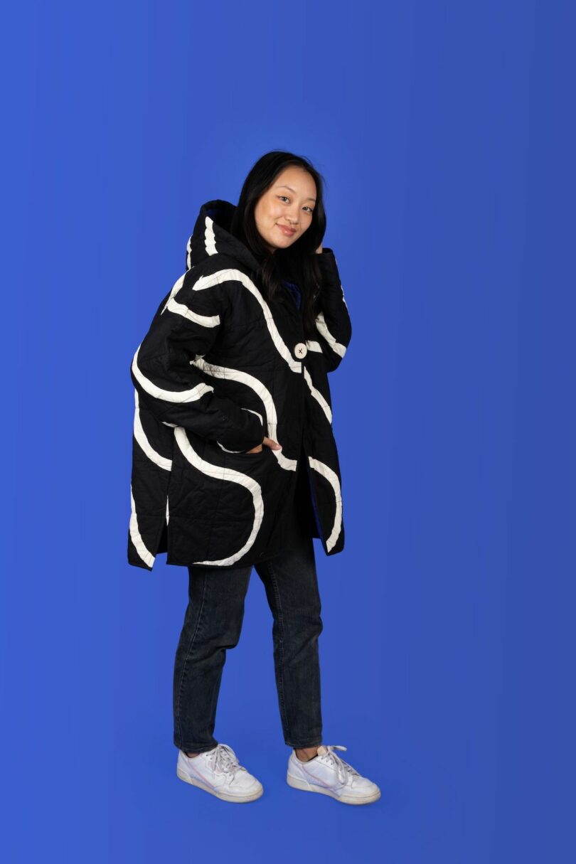 woman wearing a black and white quilted coat