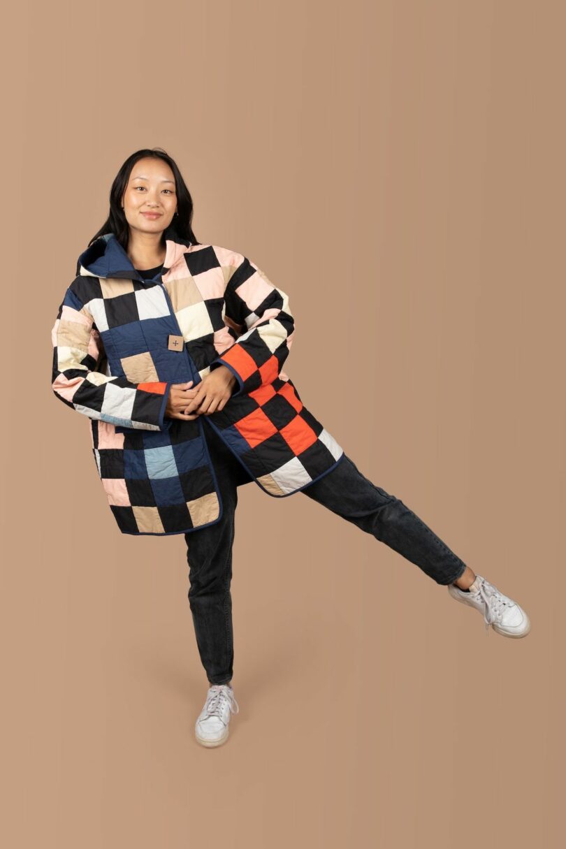 woman wearing a colorful patchwork quilted coat