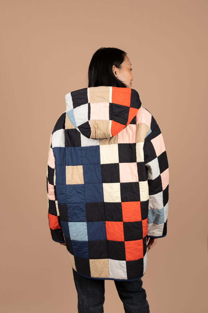 woman wearing a colorful patchwork quilted coat