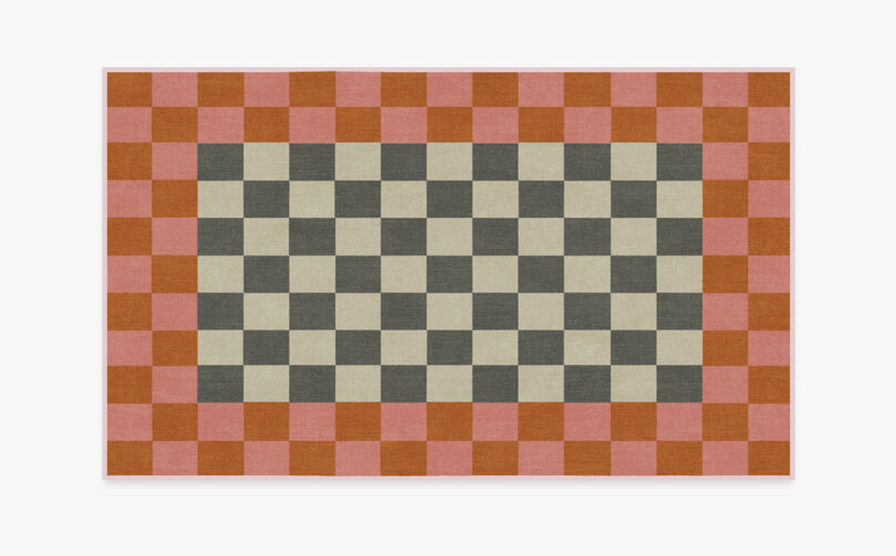 Large area rug from Ruggable x Johnathan Adler collection with checkered pattern and contrast border with checkers too.
