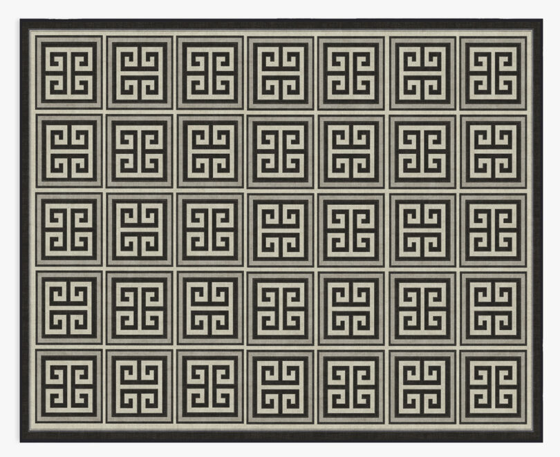 Large area rug from Ruggable x Johnathan Adler collection with Greco-Roman floor repeat pattern in stone and black.