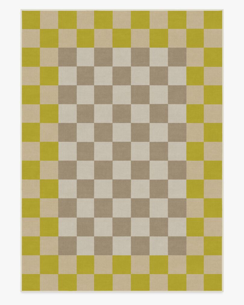 Large area rug from Ruggable x Johnathan Adler collection with checkered pattern and contrast border with checkers too.