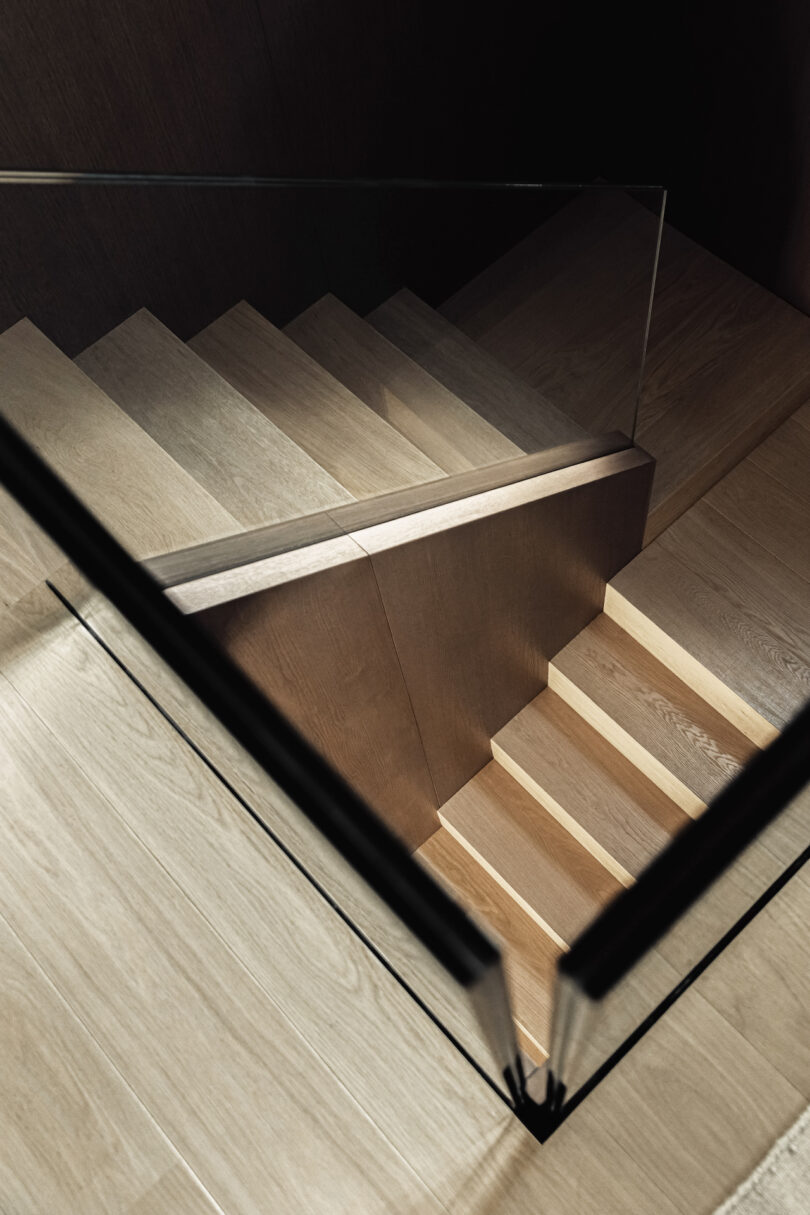 Elegant staircase connecting the ground floor to the first, complemented by wooden panelling