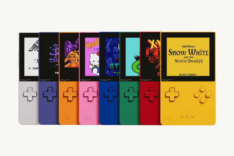 All 8 Analogue Classic Limited Edition Pocket handheld gaming machines displayed in a layered line. Left to right, shown in silver, purple, orange, pink, blue, green, red, and yellow, each with a different retro gaming title on their screen.