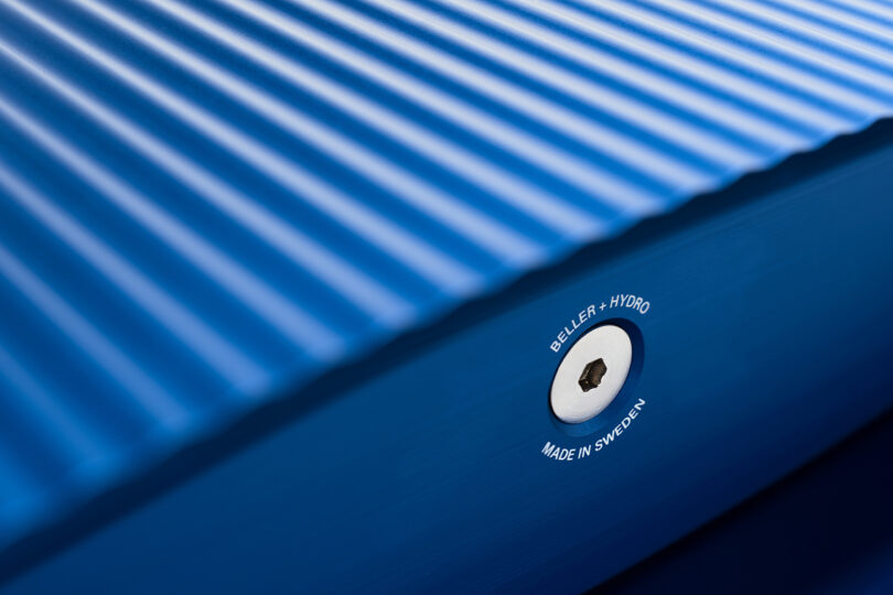 detail of bright blue aluminum outdoor bench