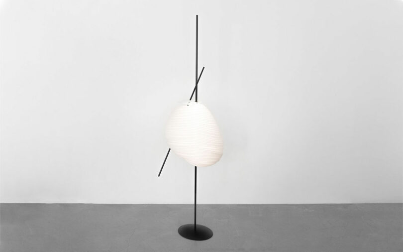 Contemporary floor lamp with a luminary that looks like a cocoon.