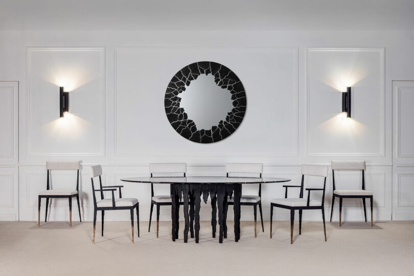 Contemporary dining room table and chairs with pointy features.