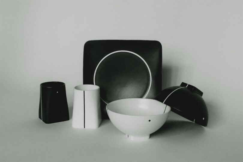 Collection of ceramic black and white bolts, plates, mugs.