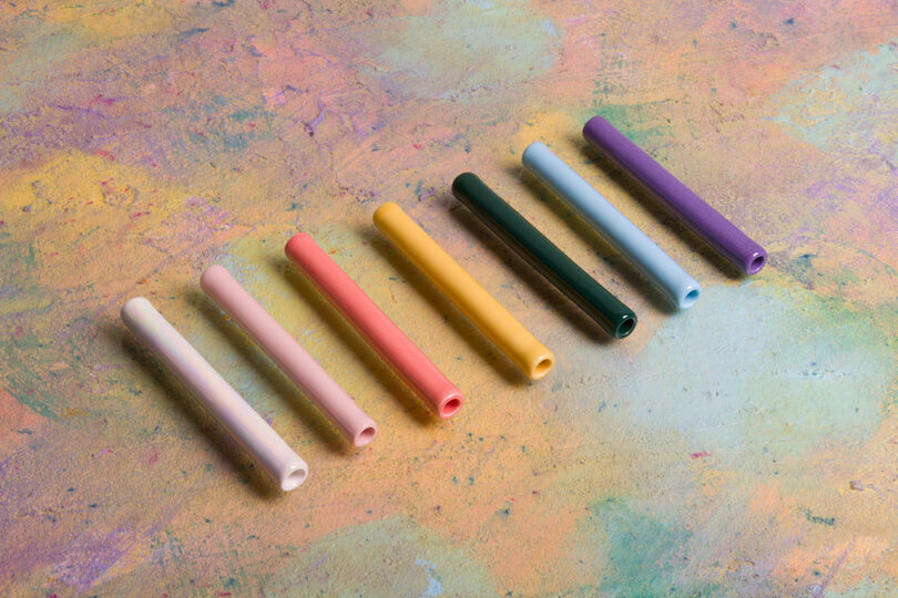 a rainbow of minimal one hitter pipes lined up in a row