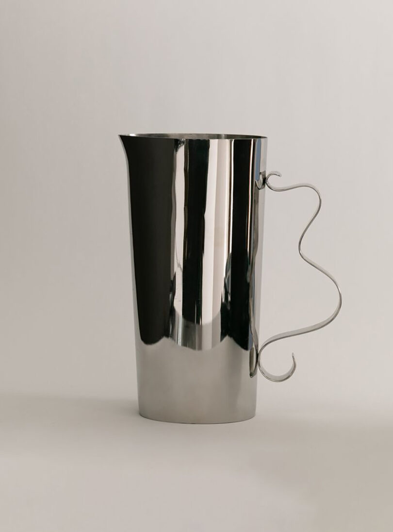 metal pitcher with a squiggly handle