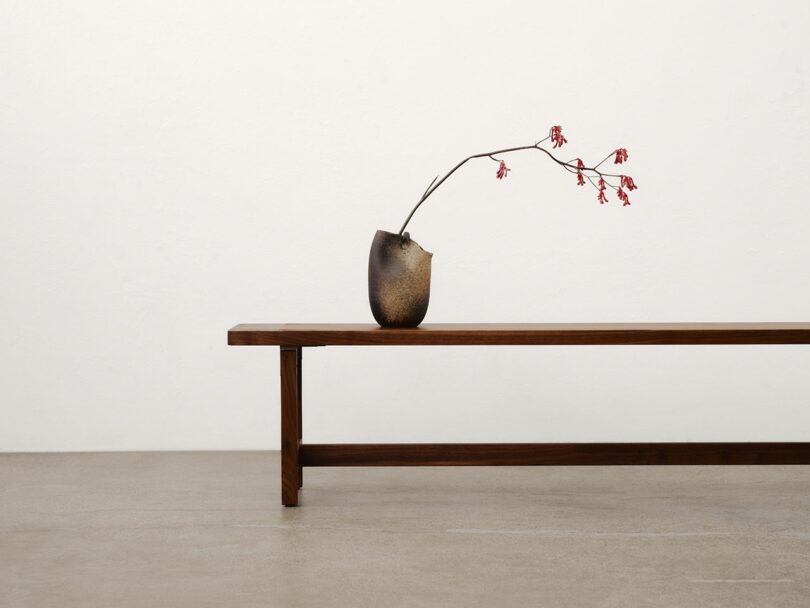 Bench with vase.