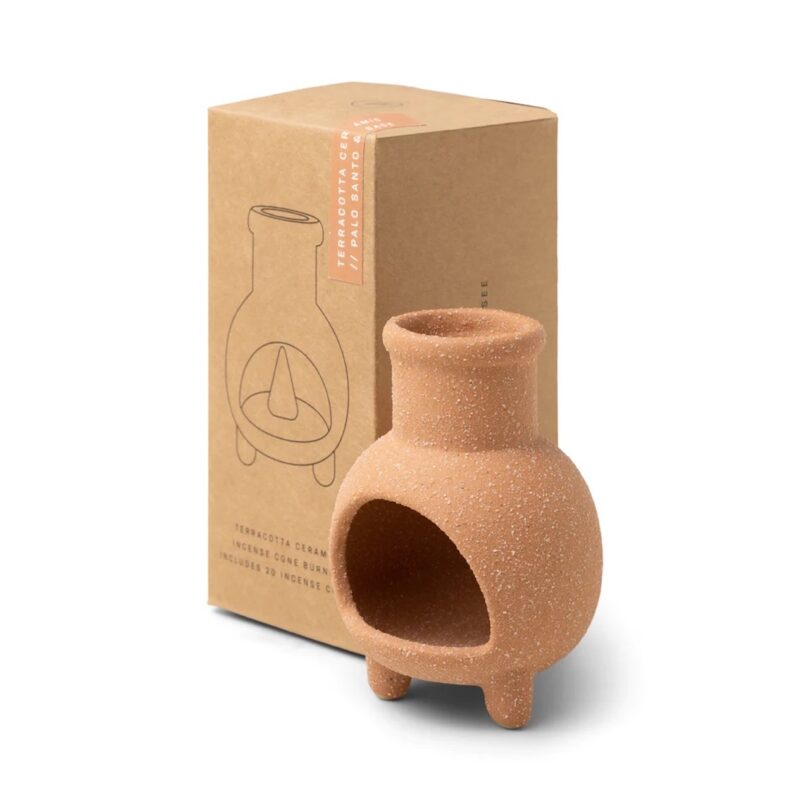 Chiminea Incense Cone Holder from Paddywax in a terracotta color next to its box
