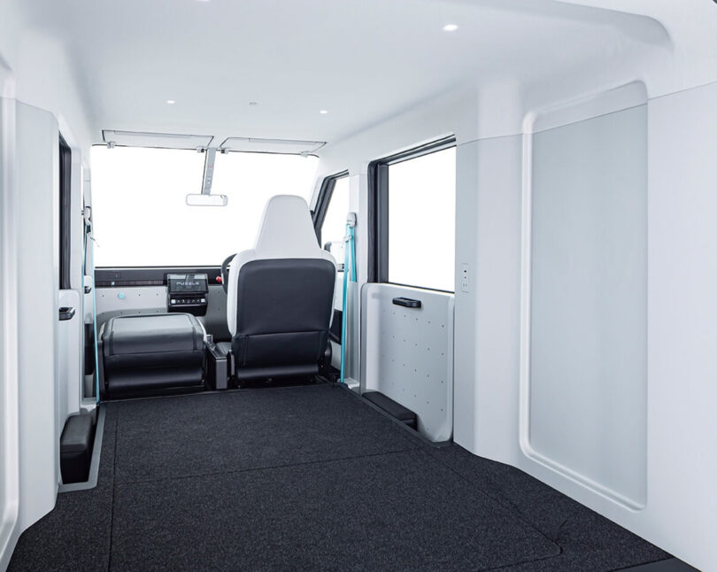 Interior of the Puzzle van concept from the viewpoint of the rear showcasing its large interior load capacity