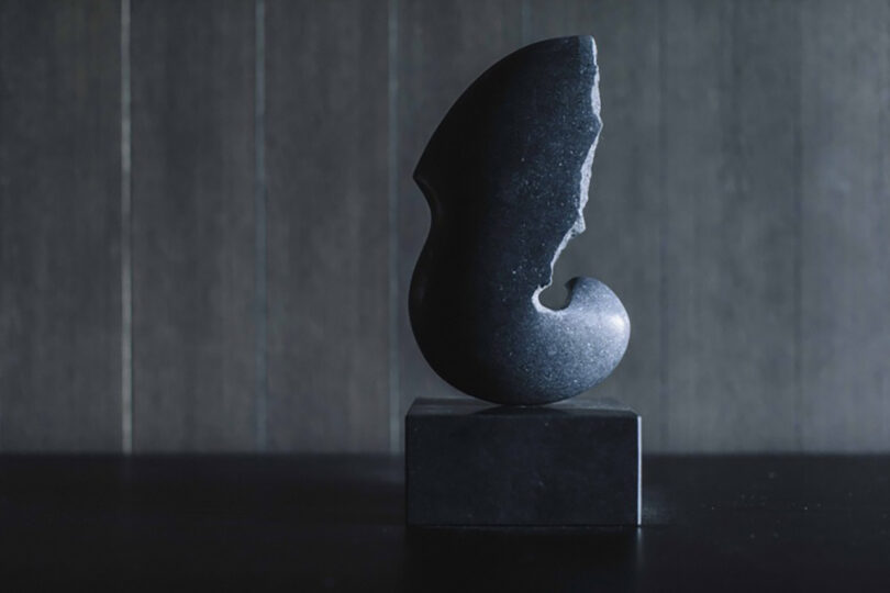Modern abstract ceramic sculpture by Masaomi Raku with craggy edge detail.