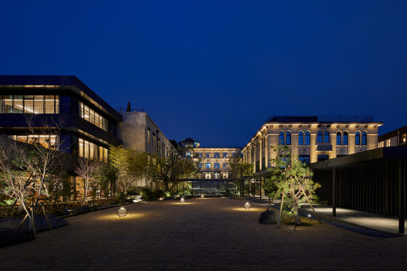 Exterior night time view of the The Hotel Seiryu Kyoto Kiyomizu with illuminated front and landscape lighting against a deep blue dusk sky.