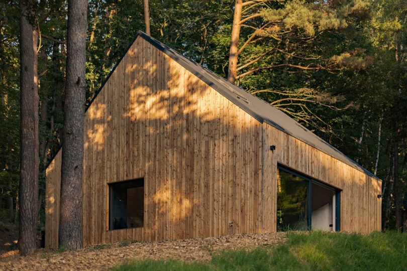 angled daytime shot of exterior of simple wood house