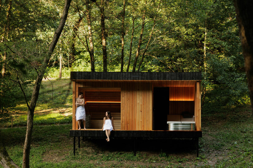 exterior shot of modern bathroom sauna in woods