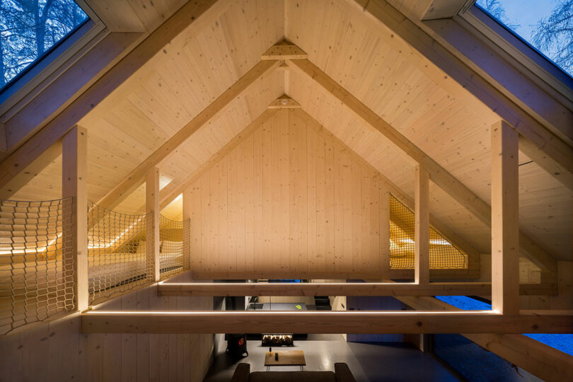 view in the rafters of a pitched roof of a modern cabin