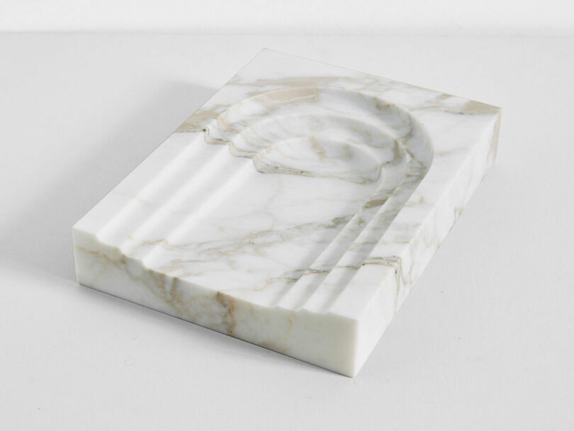 Marble trinket tray with archway beveling.