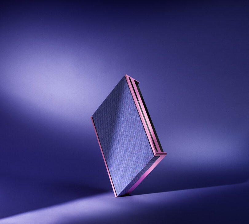 Thin pink and lilac speaker rotating on its edge.
