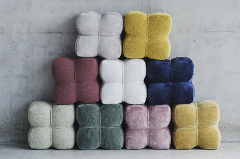 colored poufs stacked up