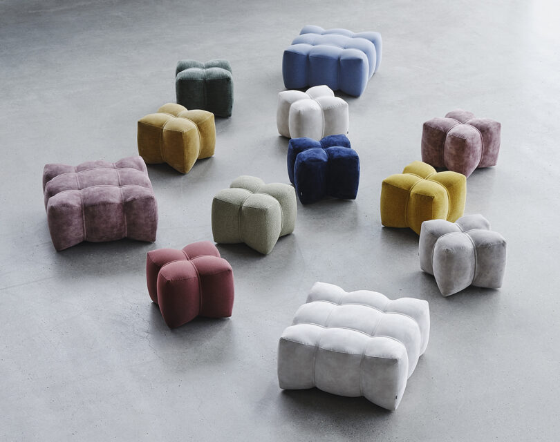 a collection of different colored poufs in two sizes