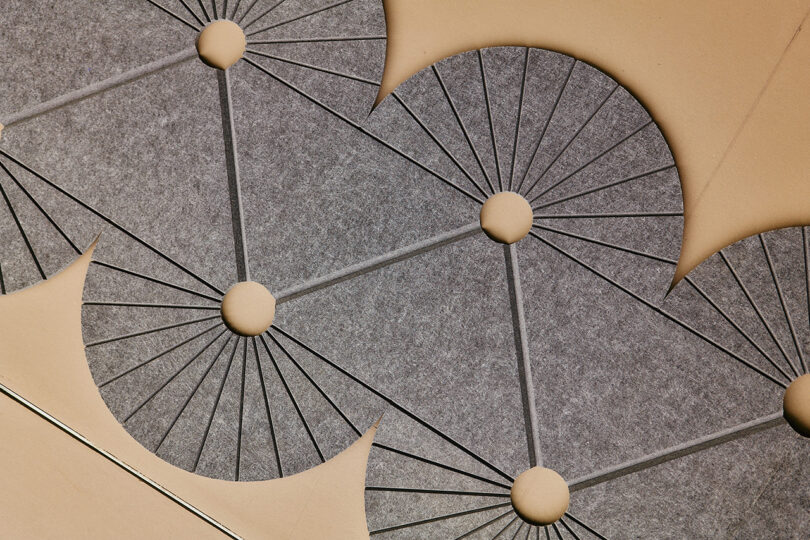 a geometric cutout of grey felt