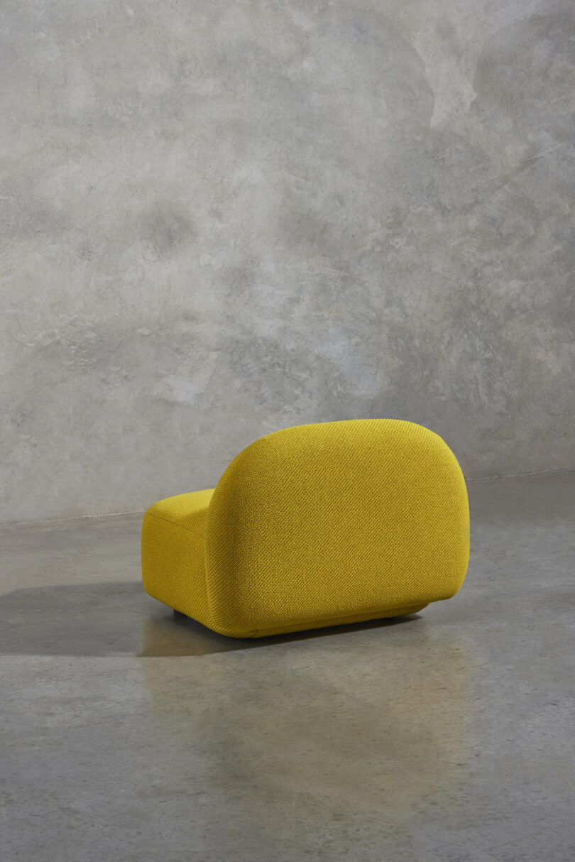 back of overstuffed modular yellow chair